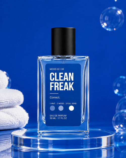 Clean Freak bottle on a glass podium with white towels and bubbles